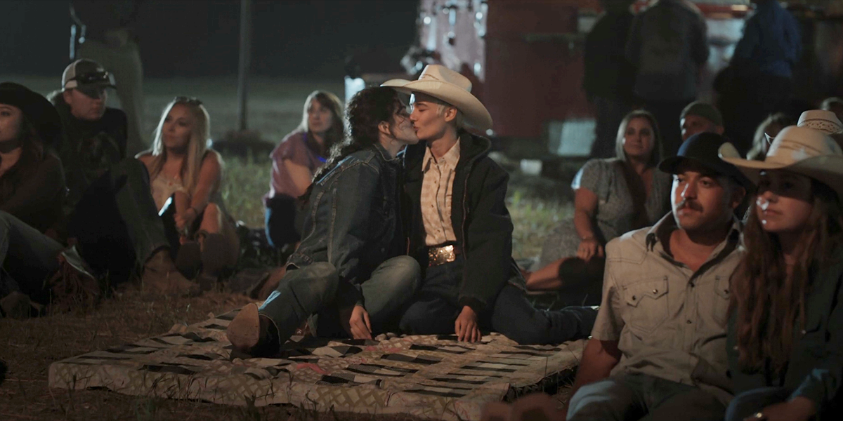 Clare kisses another woman at the state fair in Yellowstone.