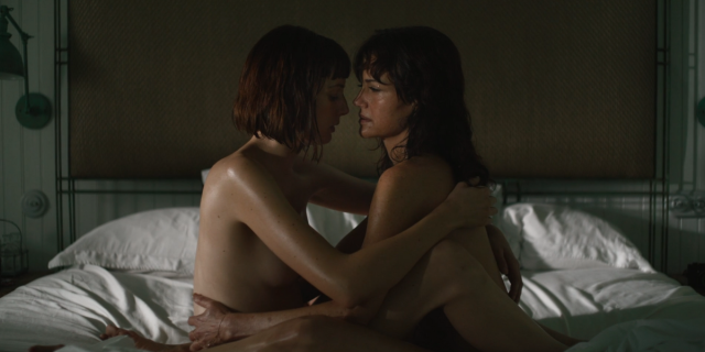 Gaite Jansen and Carla Gugino are naked and entangled in bed.