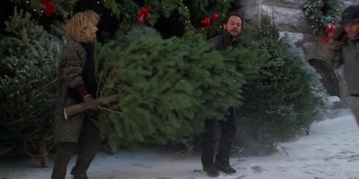 Meg Ryan and Billy Crystal carrying a Christmas tree in When Harry Met Sally