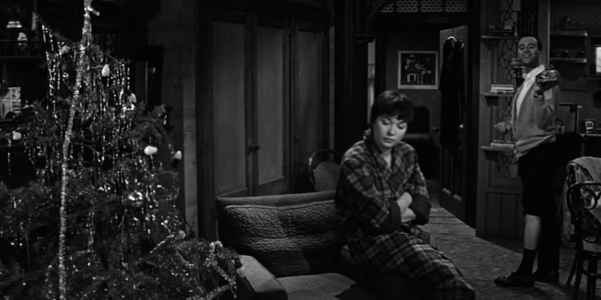Jack Lemmon and Shirley MacLaine next to a Christmas tree in The Apartment