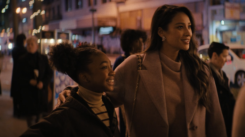 Daisy and Vanessa standing next to each other on the streets of NYC.