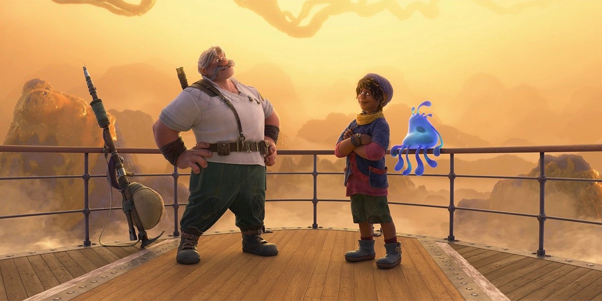 The grandson and the granddad from Strange World standing on a ship deck in the sunset