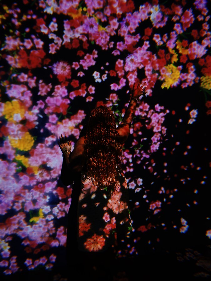Shelli in a floral exhibit at the museum