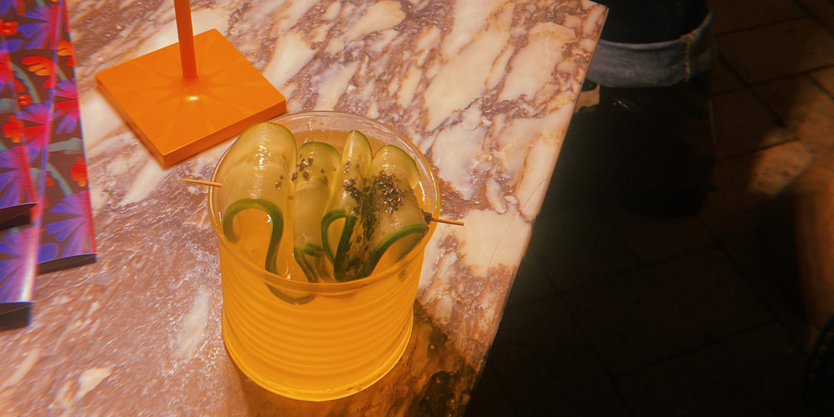 A cocktail on a marble side table