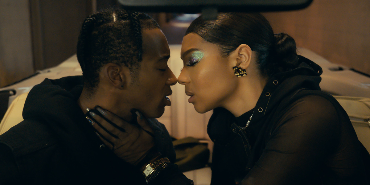 A still from "Young. Wild. Free." Algee Smith and Sierra Capri lean toward each other, poised to kiss. 