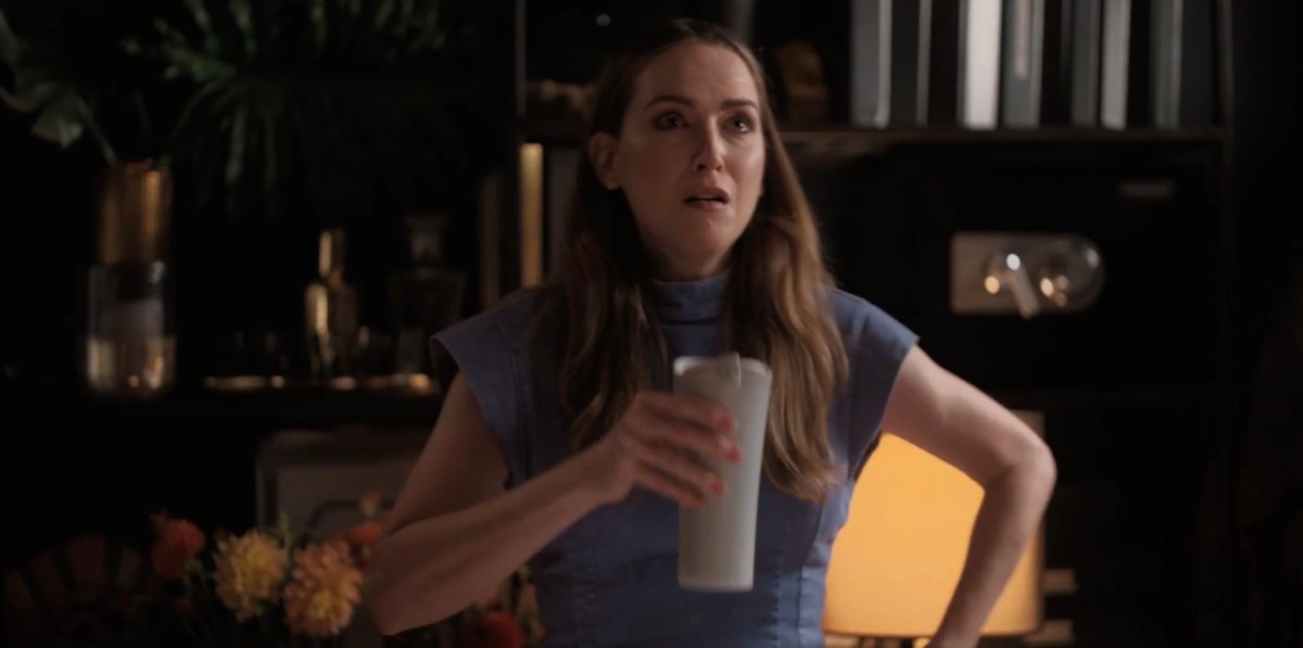Tess holding a cup