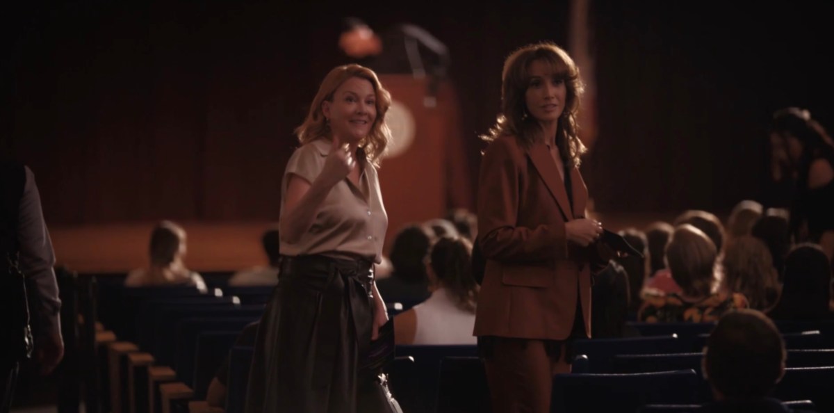 Bette and Tina in the auditorium gesturing at Bella