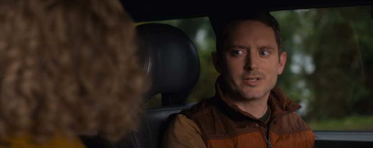 Elijah Wood wearing a striped puffy vest on Yellowjackets