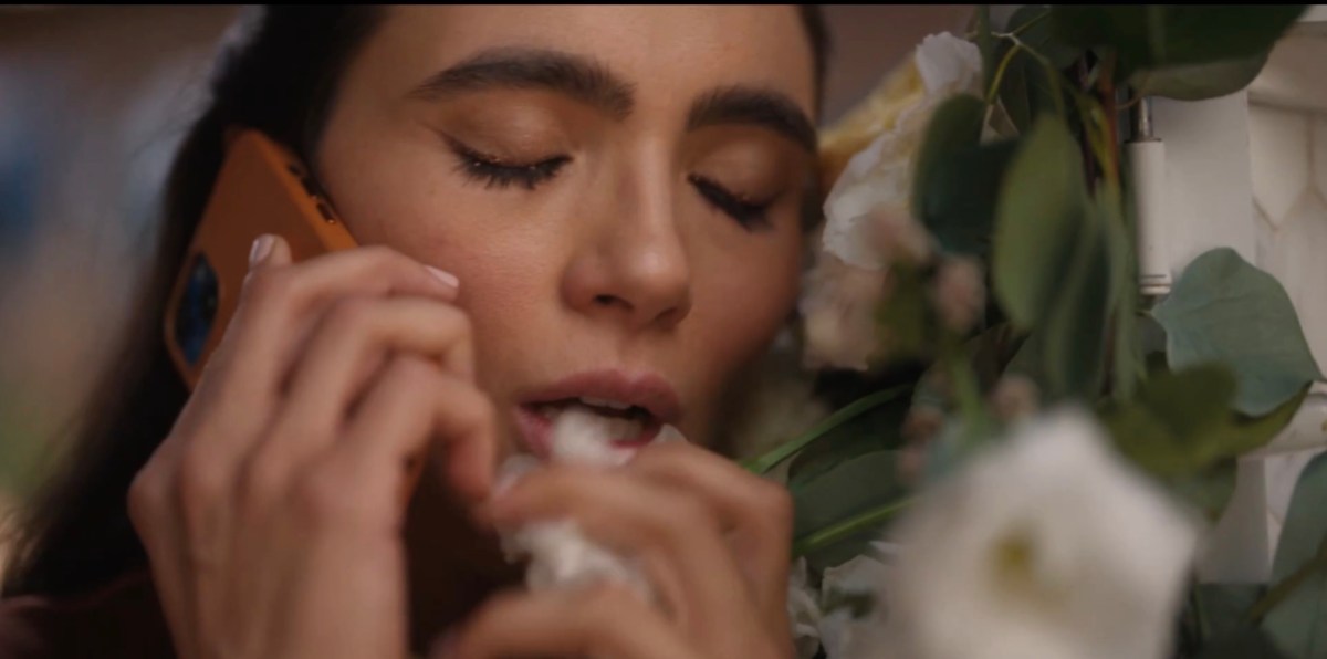 Dani eating flowers while leaving a voicemail