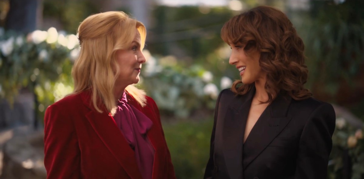 Bette and Tina smiling at each other