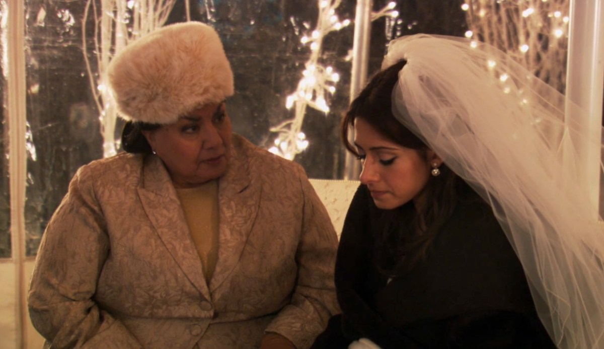 Carmen sitting with her Mom after being left at the altar