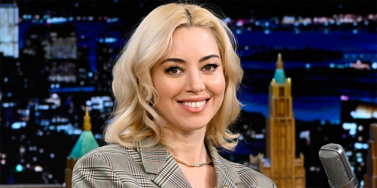 Aubrey Plaza in a plaid suit on the set of The Tonight Show