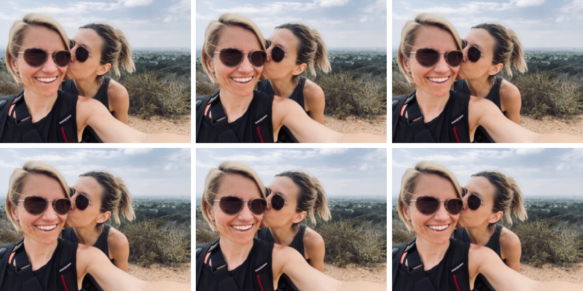 Riese and Gretchen at the top of a hike, Riese is kissing Gretchen's cheek. Los Angeles is in the background.