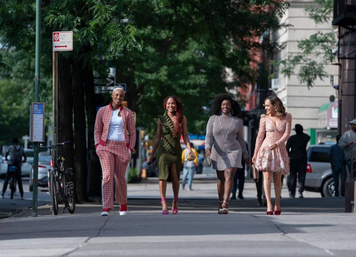 Harlem Season Two: A group of four Black women are walking down the streets of Harlem and smiling