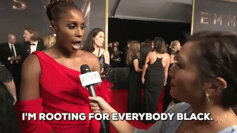 A gif of Issa Rae at the 2017 Emmys red carpet saying "I'm rooting for everyone Black"