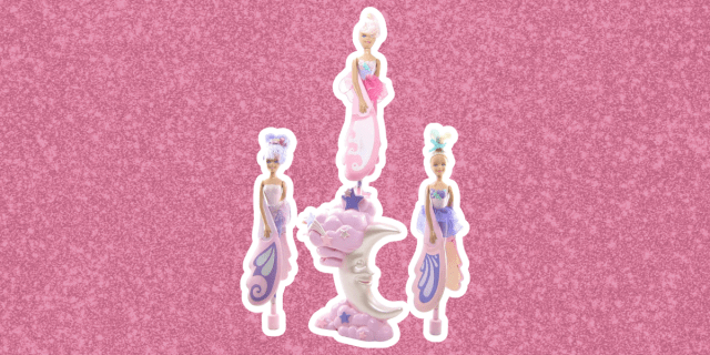 Hard plastic fairy toys against a pink glitter background