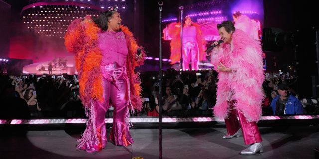 Lizzo and Harry Styles perform at Coachella in pink fluffy coats and pink pants