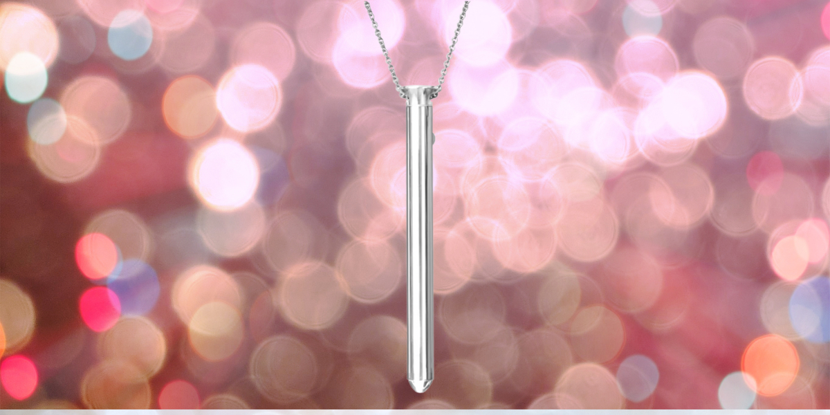 a slim, silver discreet vibrator hangs from a necklace chain