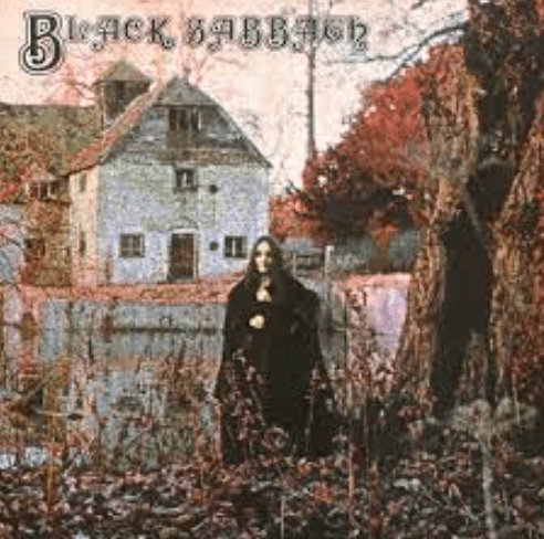 the cover of black sabbath's the wizard. it has a mysterious man standing in a rural field by a farmhouse looking creepy