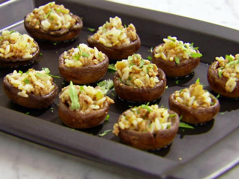 a platter of rice stuffed mushrooms