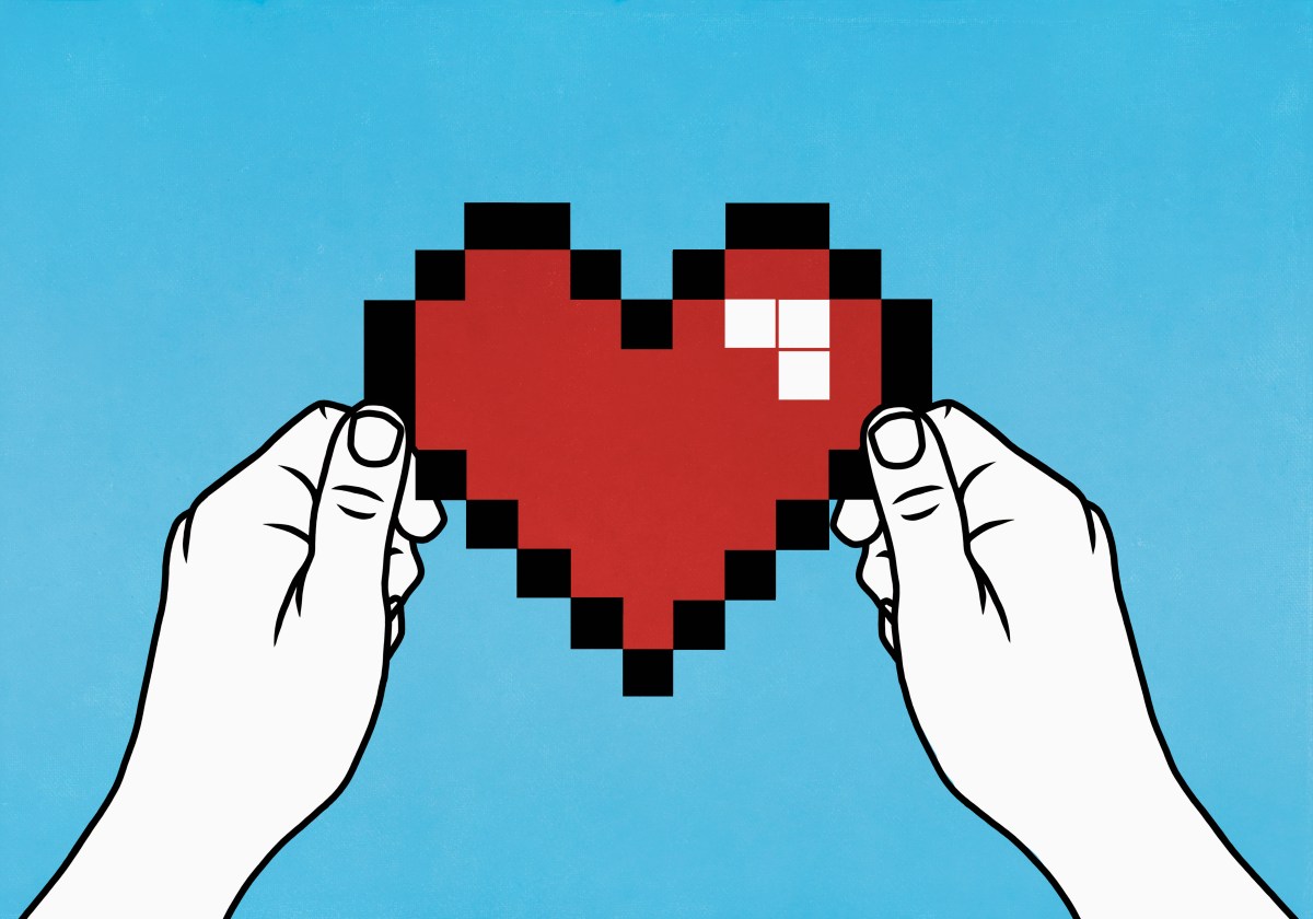 Hands holding a pixelated heart