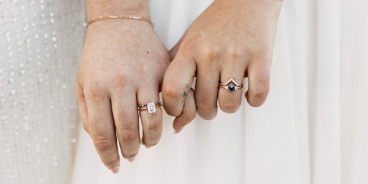 two hands, both belonging to white women, show off two gorgeous and unique engagement rings