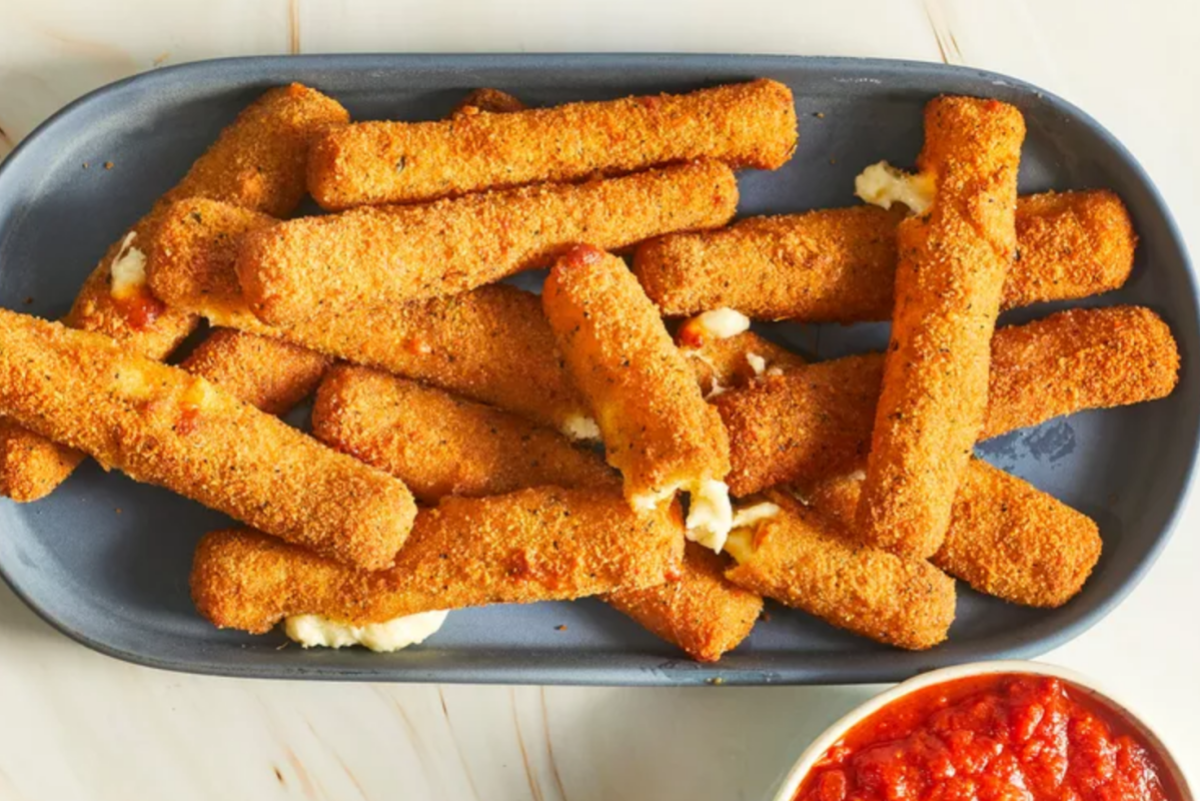 a plate of mozzarella sticks and a side of marinara