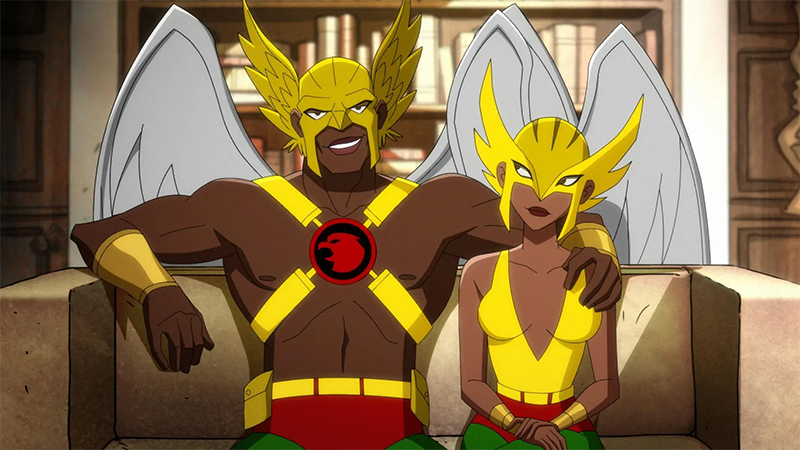 Hawkman and Hawkgirl sit together on a couch