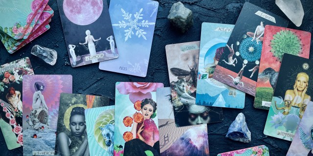 cards from the muse tarot and the spacious tarot expansion pack, laid out on a table