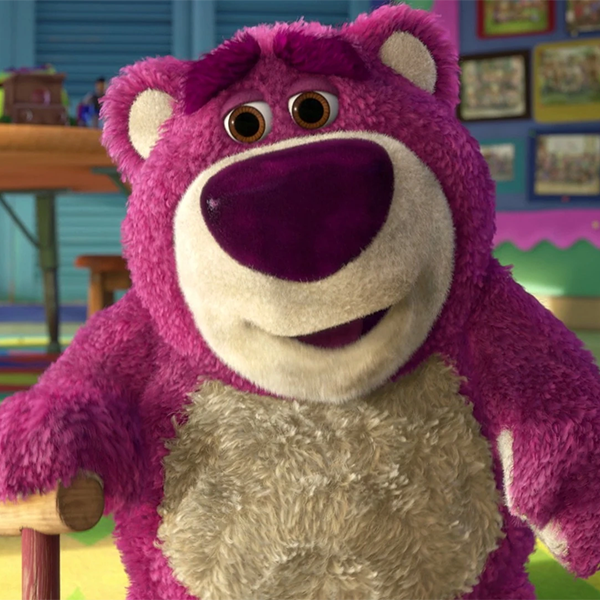 Lots-o'-Huggin' Bear, dirty and purple and smiling menacingly 