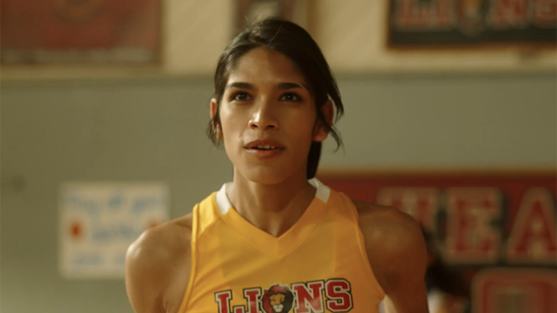 Gia in her basketball uniform eyeing the goal on Quantum Leap