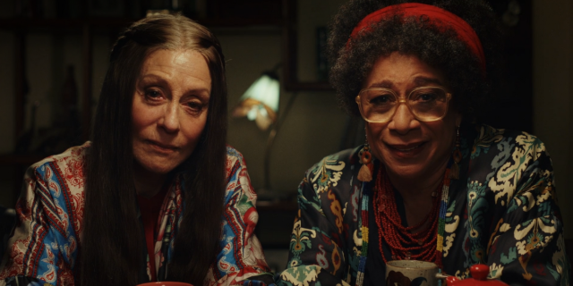 Judith Light and S. Epatha Merkerson in Poker Face look directly at the camera and look like they're upset.