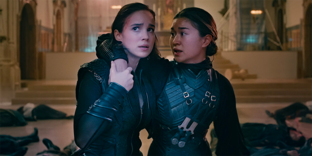 Ava and Beatrice with their arms wrapped around each other in Warrior Nun
