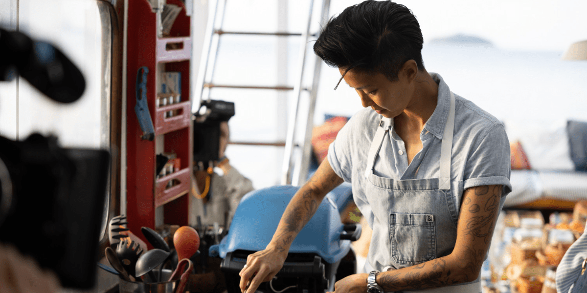 Korean-American chef Kristen Kish cooking on a boat. 