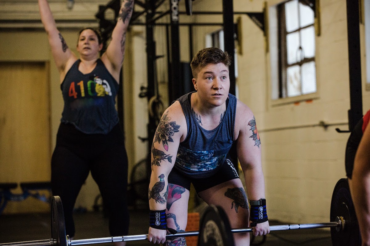 Two members at 410 Fitness gym participate in the daily Strength and Conditioning class