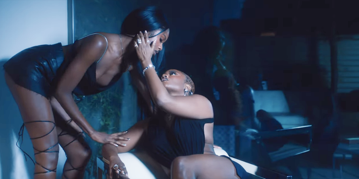 A screenshot from Amaarae's new music video for "Reckless & Sweet," featuring two women caressing each other.