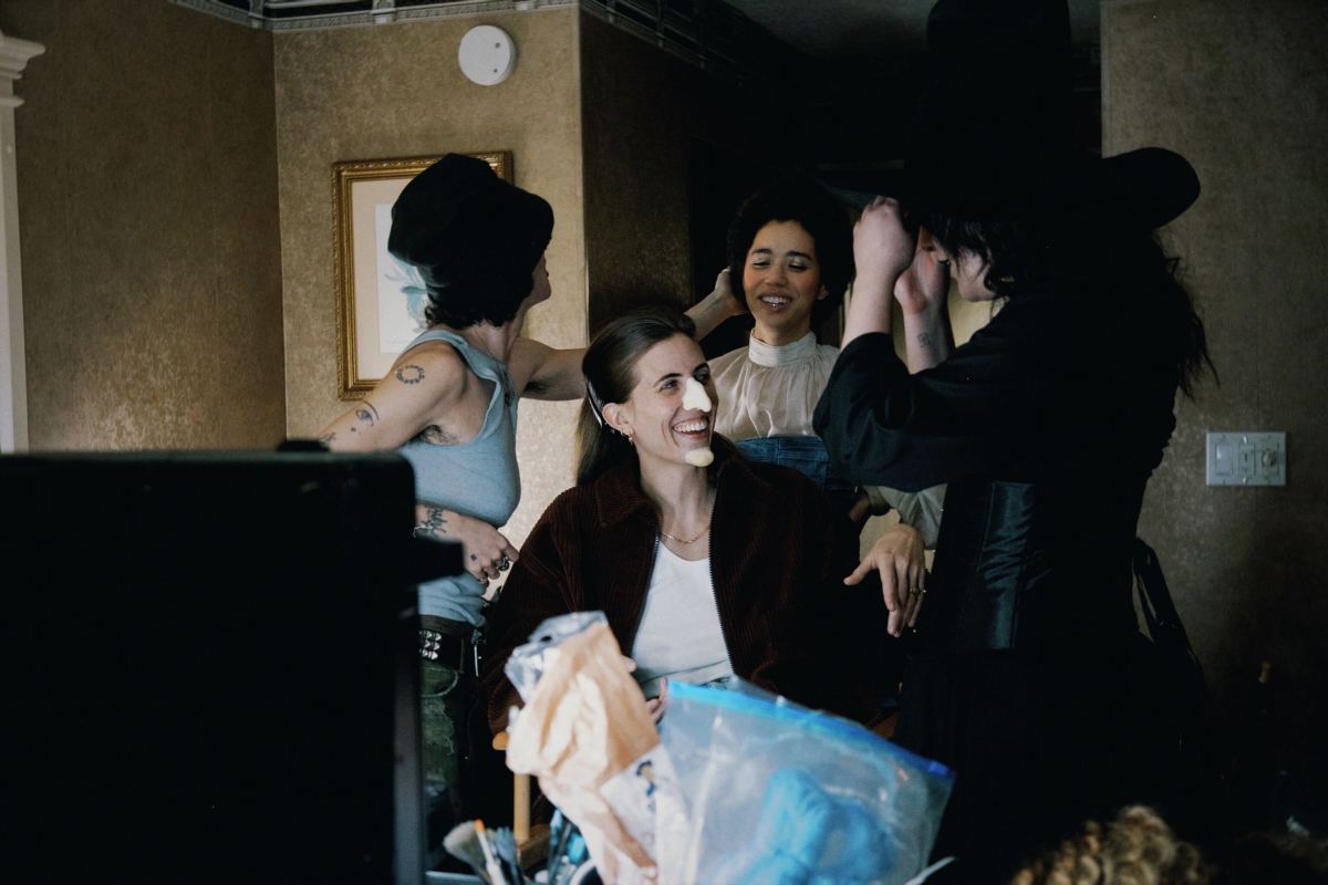 Jasmin Savoy Brown, E.R. Fightmaster, and Lucy Dacus getting into Wizard of Oz costumes for the "Night Shift" music video.