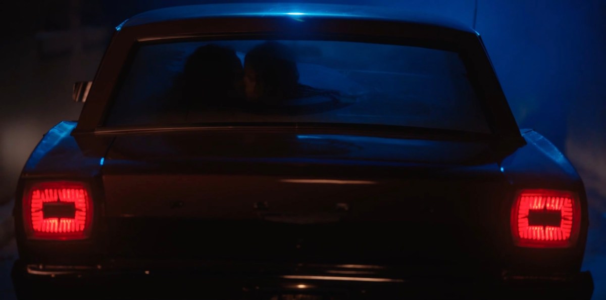 shot of Ivy and Shane in the backseat of her car