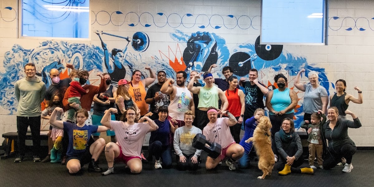 a giant group of gym members at Solcana pose for a shot — there are people of all genders, races, fitness levels, and size in the community photo