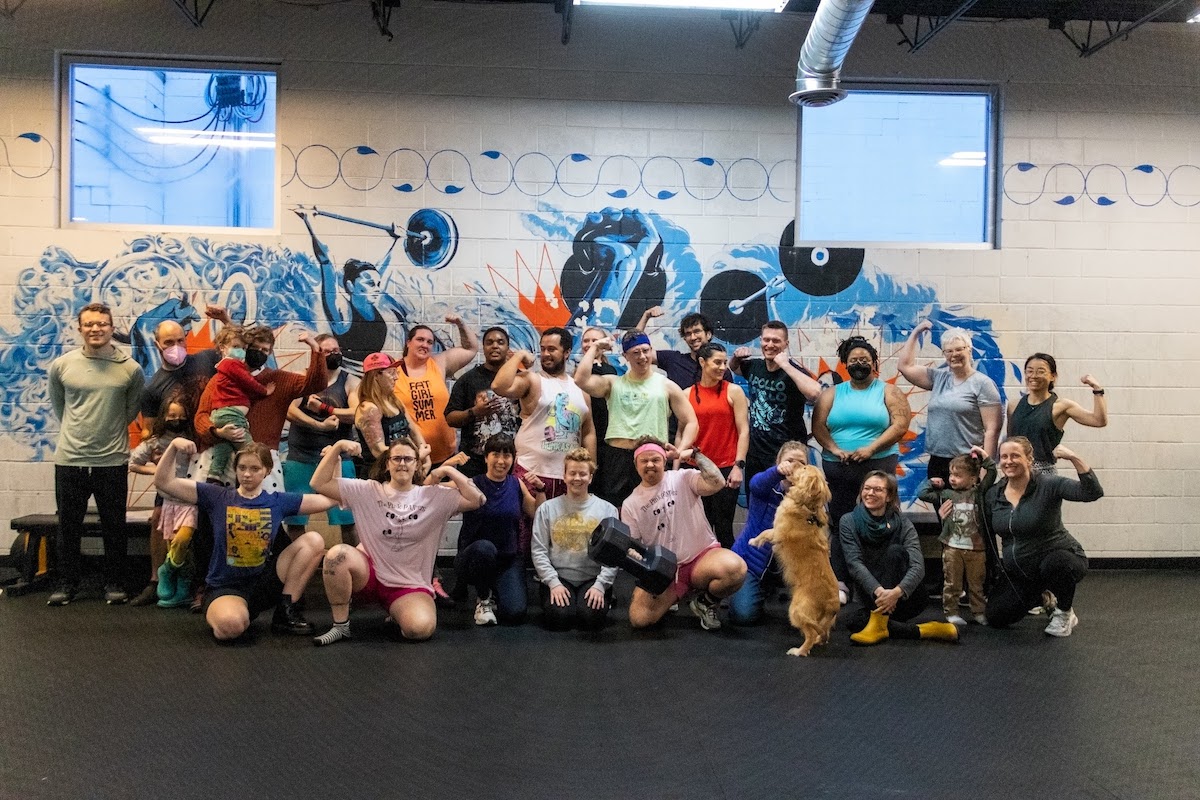 a giant group of gym members at Solcana pose for a shot — there are people of all genders, races, fitness levels, and size in the community photo