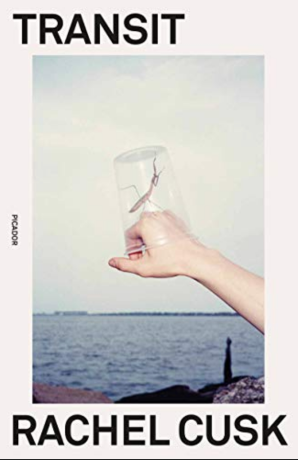 the cover of transit has a photo of a white hand with a glass on it in front of an ocean