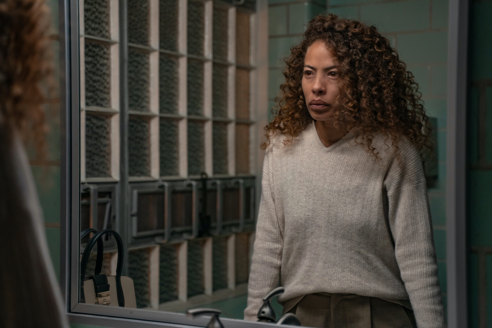 Yellowjackets - Season 2 Tawny Cypress as Taissa in YELLOWJACKETS Season 2 staring in a mirror looking serious. Photo Credit: Colin Bentley/SHOWTIME.