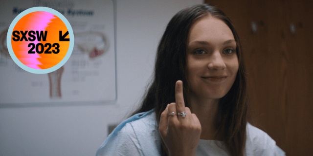 A still from "Bloody Hell" where a girl is in a doctors office and giving the middle finger. A circle in the corner reads "SXSW 2023"