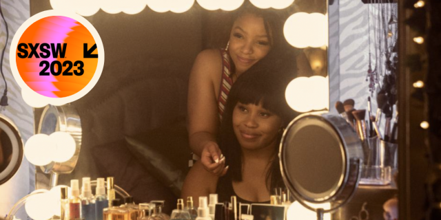 A still from "Swarm" where two Black women are looking at their reflections in the mirror and smiling. A round badge in the corner reads "SXSW"