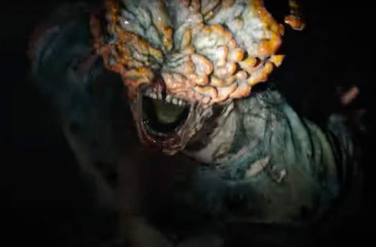a screenshot of one of the clickers from the last of us which is a gross mushroom zombie