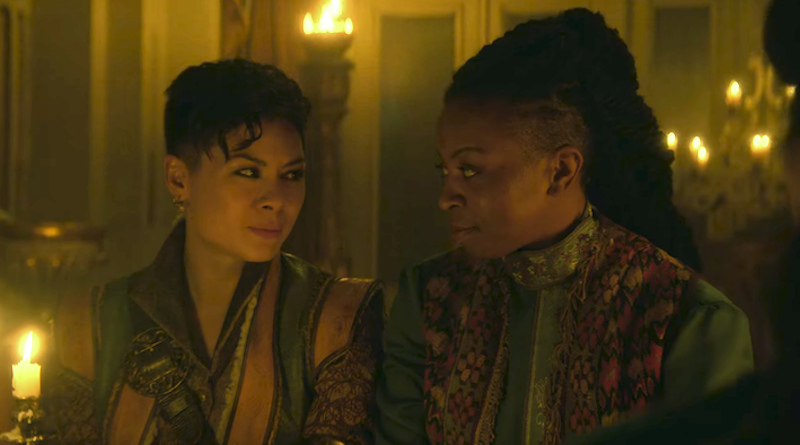 Screenshot of Tamar and Nadia gazing into each other's eyes while sitting at a banquet table.