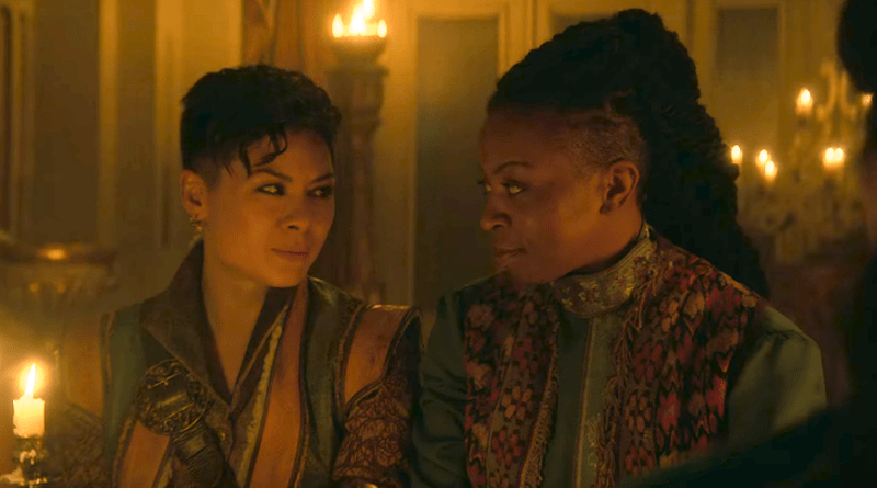 Screenshot of Tamar and Nadia gazing into each other's eyes while sitting at a banquet table.