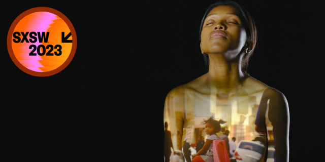 A still from the film "Who I Am Not" which shows a Black intersex woman closing her eyes with her head to the sky, and a picture of a young Black girl is projected onto her chest.