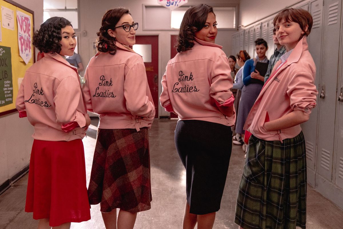 Four Pink Ladies from "Grease: Rise of the Pink Ladies", looking over the shoulder of the jacket