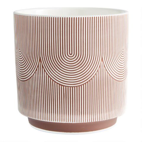 a planter with a terracotta swirl pattern